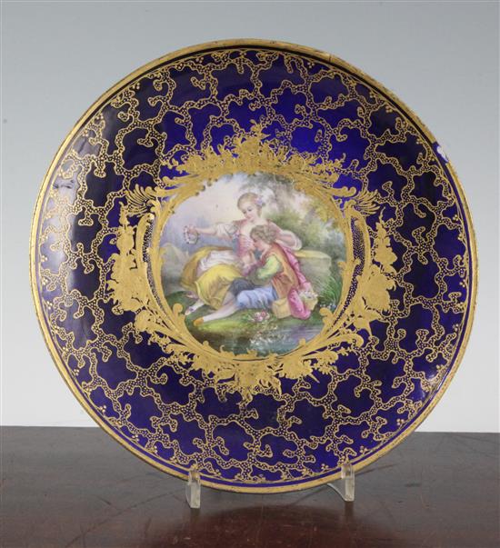A Sevres style plate, possibly an 18th century blank later decorated 24.5cm